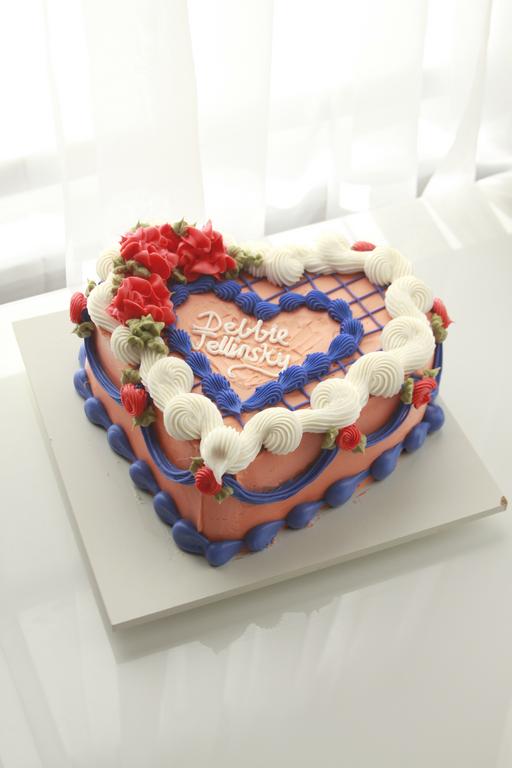 Black Widow Cake with red, white, and blue buttercream piping