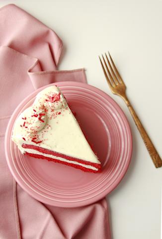 Streamlined red velvet cake on a pink plate
