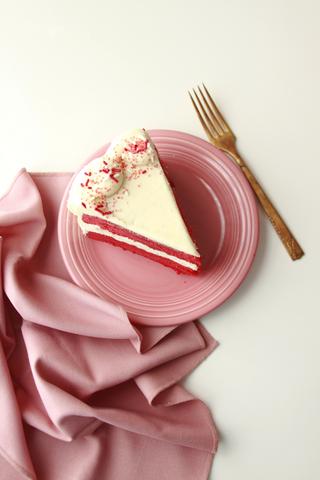Side view of a slice of streamlined red velvet cake